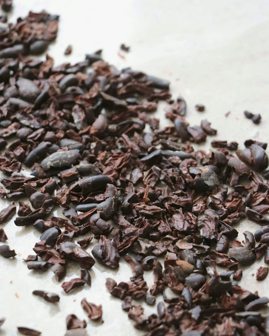 Crushed cacao nibs scattered on a counter